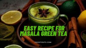 A cup of masala green tea having lemon and spices around it