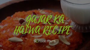 A bowl of Gajar ka Halwa garnished with nuts