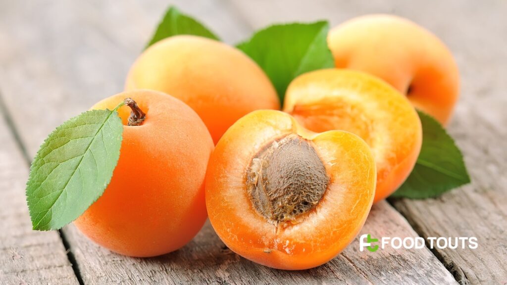 Sliced apricots placed on a wooden table